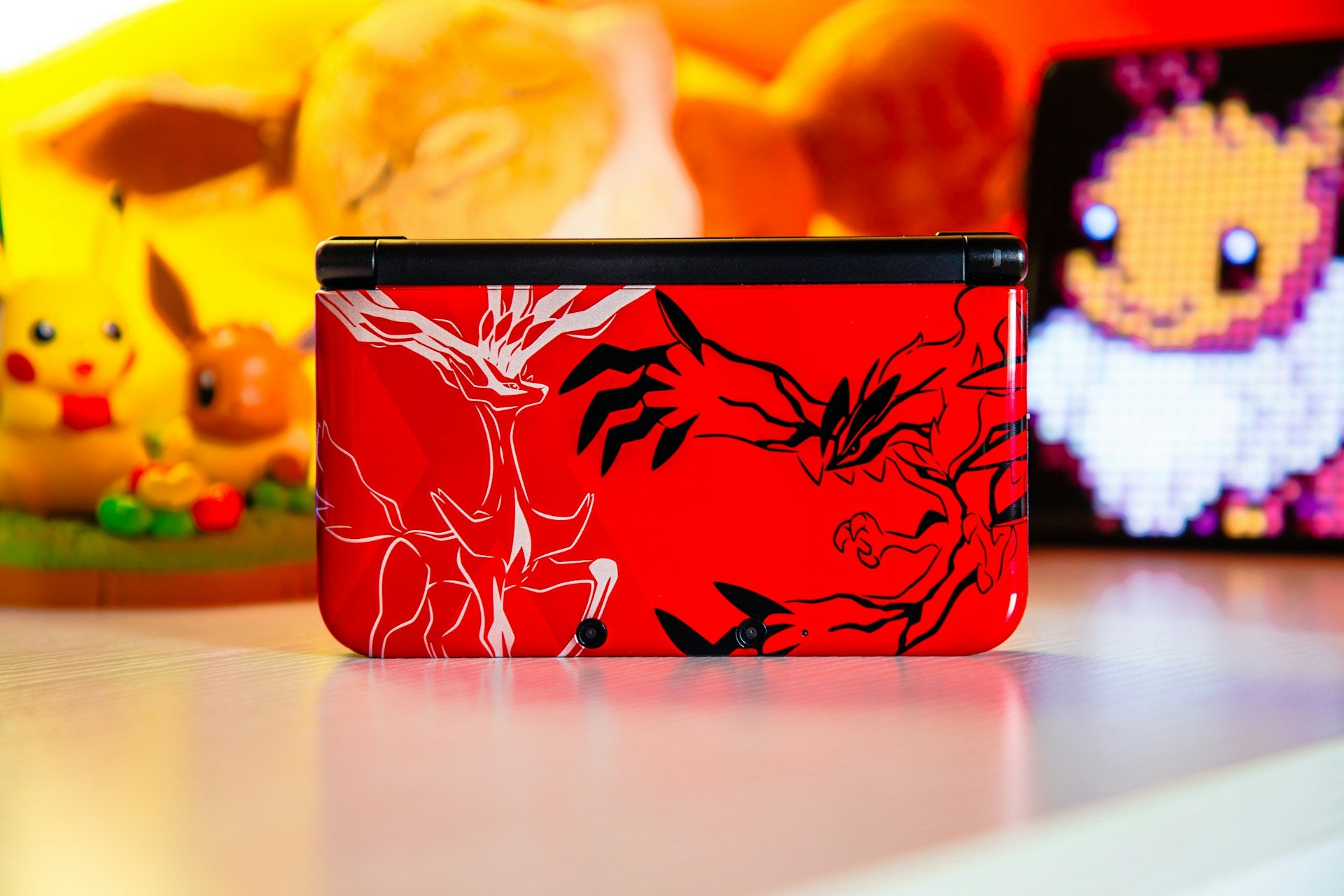 a Pokémon-themed Nintendo DS on a table