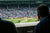Fans watching a baseball game from the stadium