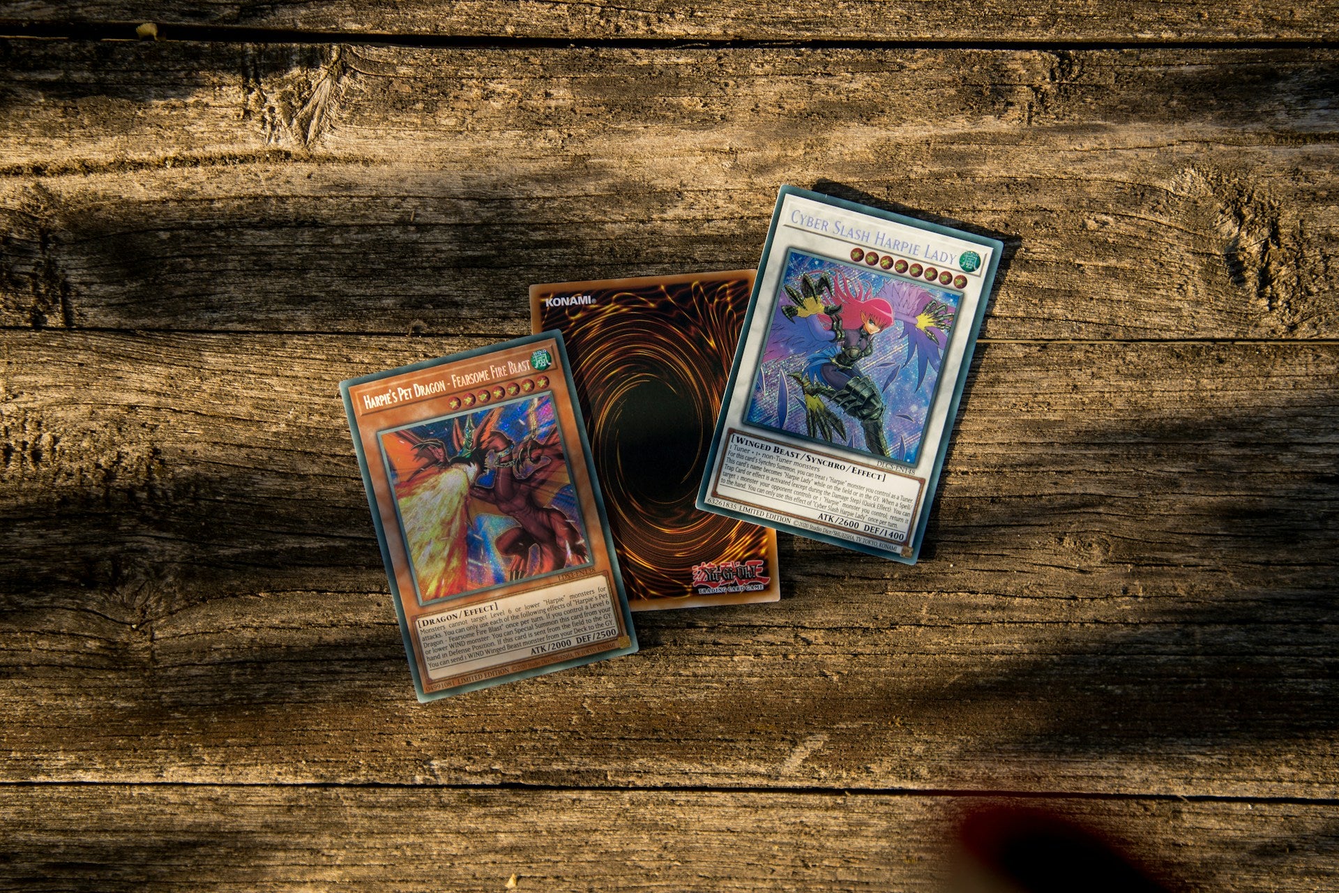 three Yu-Gi-Oh! Cards on a table