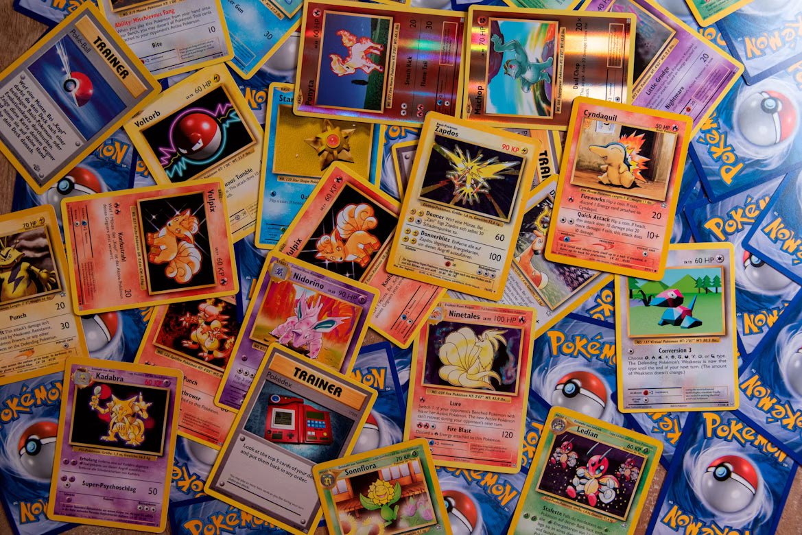 Vintage Pokémon cards spread out for trading Pokémon cards and collecting