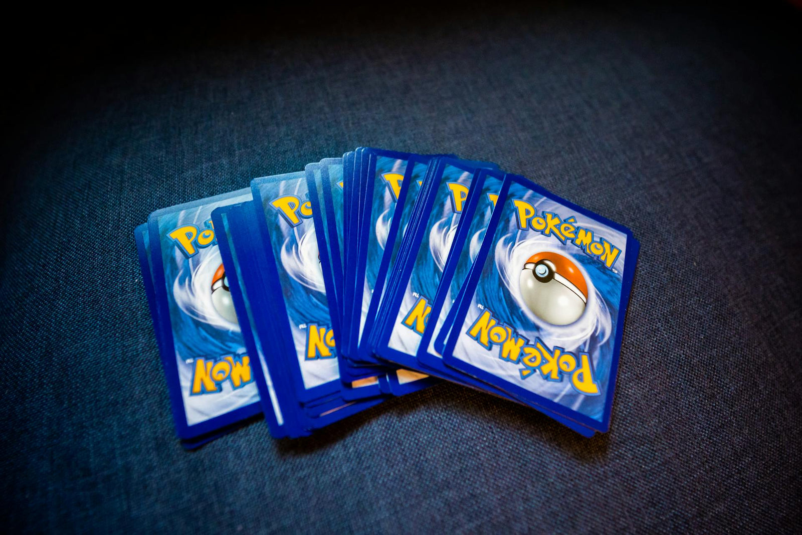 blue Pokémon cards fanned out