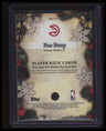 2025-26 Topps Holiday Trae Young Player Relics Red Glitter #/10
