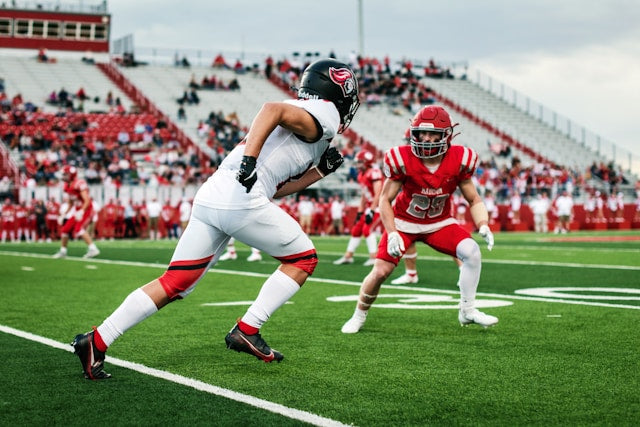 Two football players on a field 