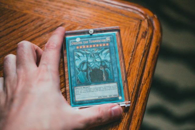 A Yu-Gi-Oh! trading card resting on a table